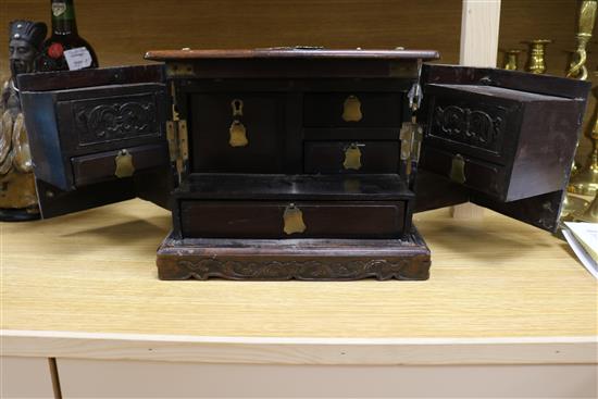 A Chinese brass mounted hardwood box, fitted numerous compartments